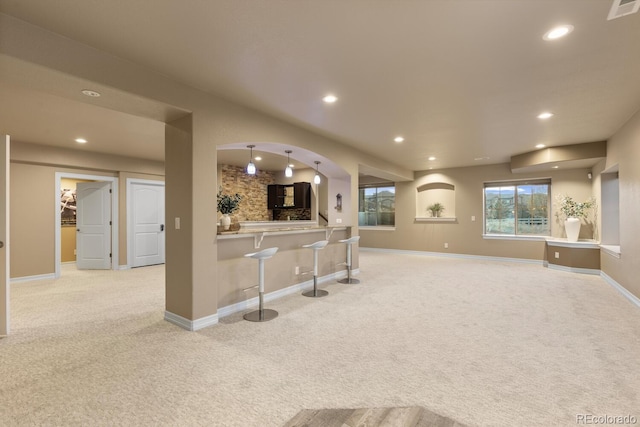 771 Braesheather Pl, Highlands Ranch, CO 80126 - kitchen featuring a kitchen bar, visible vents, baseboards, light colored carpet, and recessed lighting