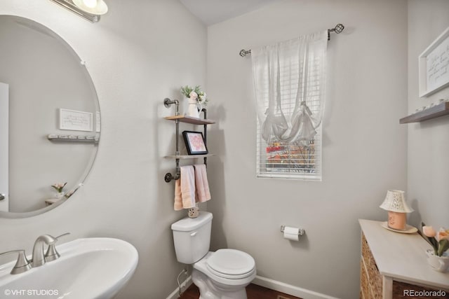 bathroom with toilet and sink