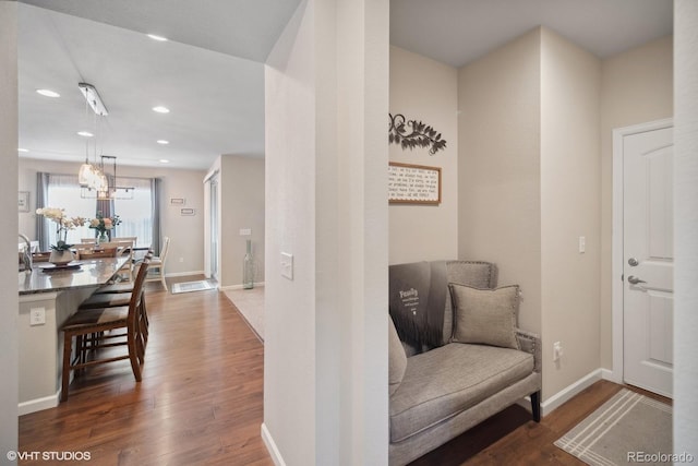 corridor featuring dark hardwood / wood-style flooring