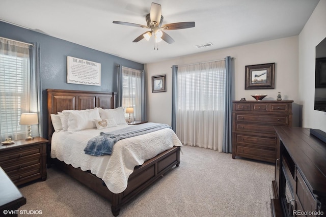 carpeted bedroom with ceiling fan