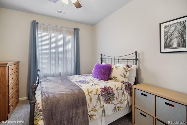 bedroom featuring dark colored carpet and ceiling fan