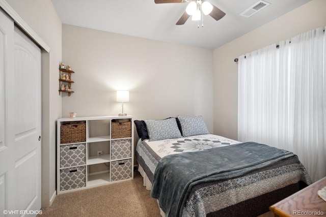 bedroom featuring carpet floors, a closet, and ceiling fan