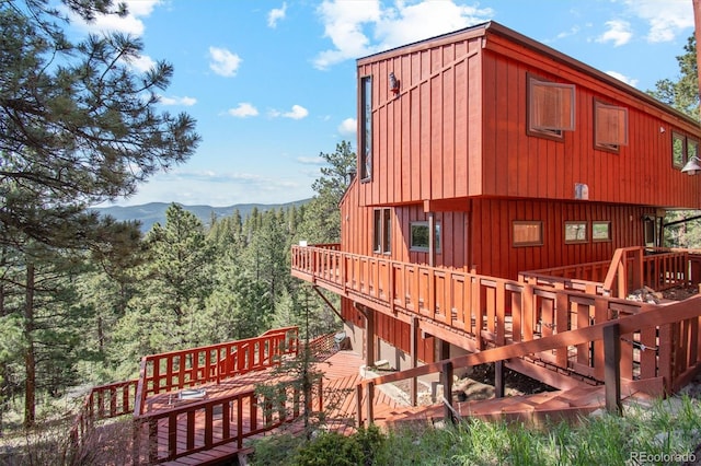 1278 Aspen Dr, Evergreen, CO 80439 - view of home's exterior featuring a deck with mountain view and a view of trees