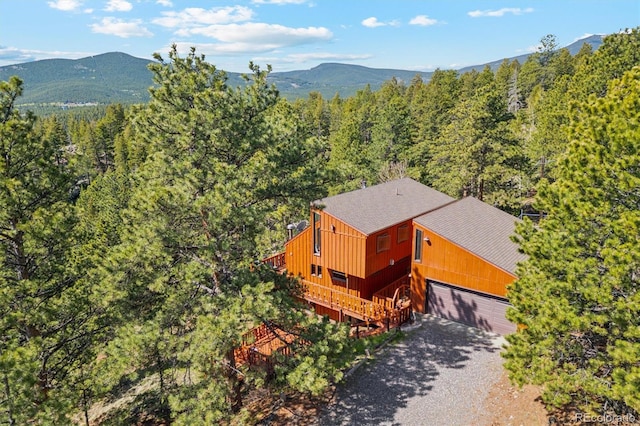 1278 Aspen Dr, Evergreen, CO 80439 - view of subject property featuring a forest and a mountainous background