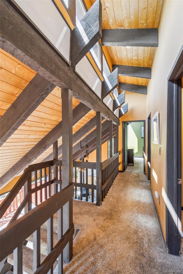 1278 Aspen Dr, Evergreen, CO 80439 - corridor with carpet, healthy amount of natural light, wooden ceiling with exposed beams, and high vaulted ceiling