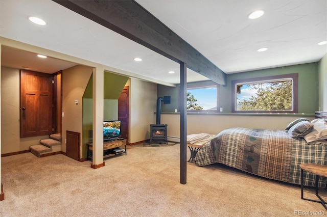 1278 Aspen Dr, Evergreen, CO 80439 - bedroom featuring recessed lighting, carpet flooring, a wood stove, beam ceiling, and baseboards