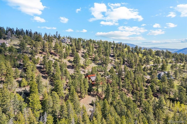 1278 Aspen Dr, Evergreen, CO 80439 - drone / aerial view of a heavily wooded area and a mountain backdrop