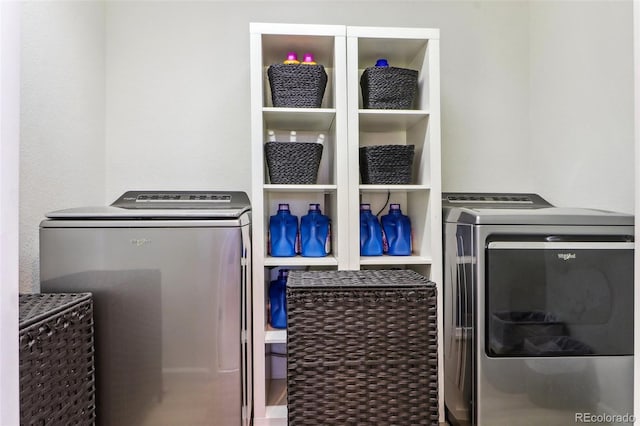 washroom with laundry area and washer and dryer