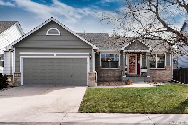 view of front of property with brick siding, an attached garage, concrete driveway, and a front yard