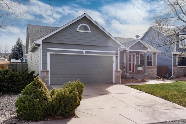 ranch-style house with brick siding, fence, concrete driveway, roof with shingles, and an attached garage