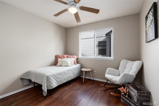 bedroom with a ceiling fan, baseboards, and wood-type flooring