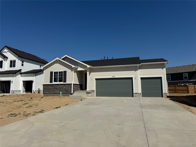 4938 Brangus Dr, Windsor, CO 80528 - view of front of home with a garage and concrete driveway