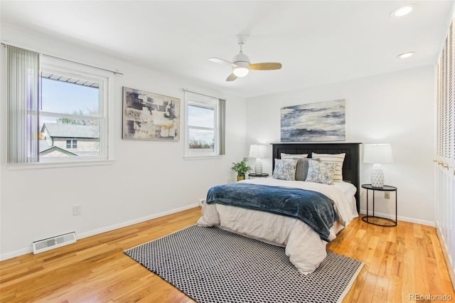 bedroom with ceiling fan, visible vents, baseboards, light wood finished floors, and recessed lighting