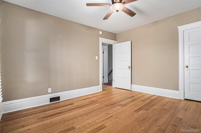 1419 N Adams St, Denver, CO 80206 - spare room with a ceiling fan, wood finished floors, and baseboards