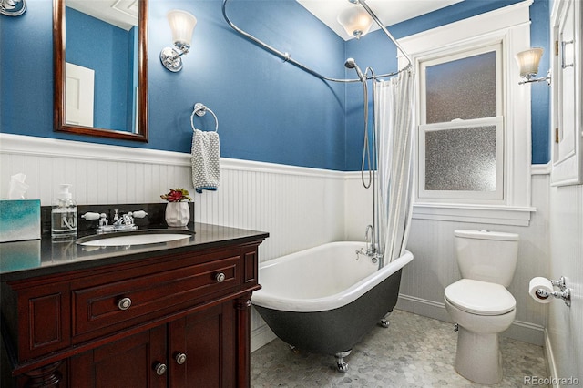 1419 N Adams St, Denver, CO 80206 - bathroom with wainscoting, vanity, and toilet