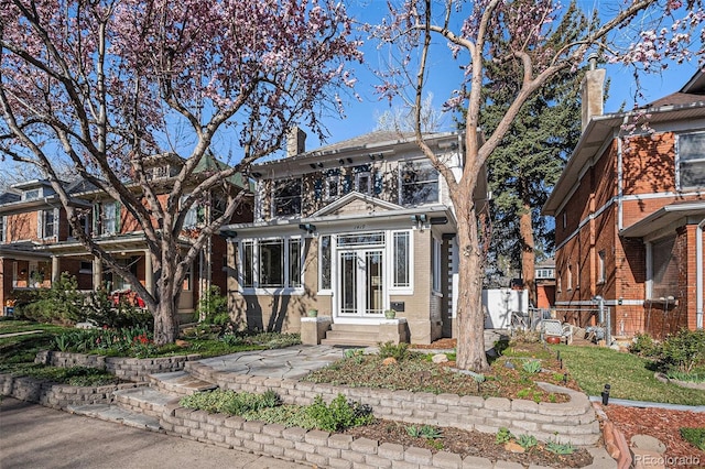 1419 N Adams St, Denver, CO 80206 - view of front of house featuring brick siding and a chimney