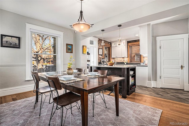 1419 N Adams St, Denver, CO 80206 - dining room with baseboards and dark wood-style floors