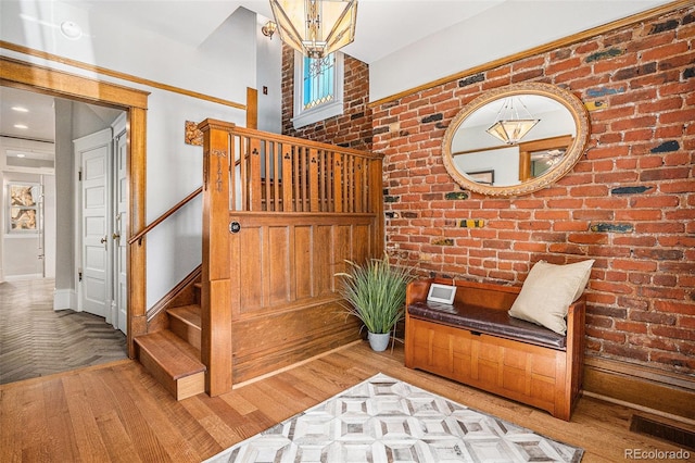 1419 N Adams St, Denver, CO 80206 - stairway featuring brick wall and wood finished floors