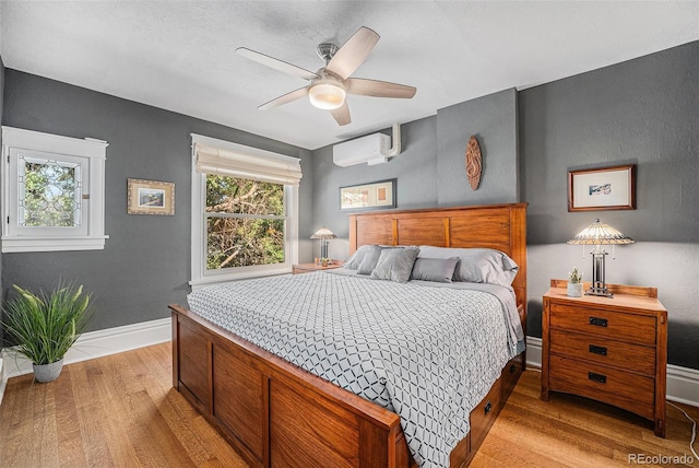 1419 N Adams St, Denver, CO 80206 - bedroom featuring light wood-style flooring, a wall mounted air conditioner, and a ceiling fan