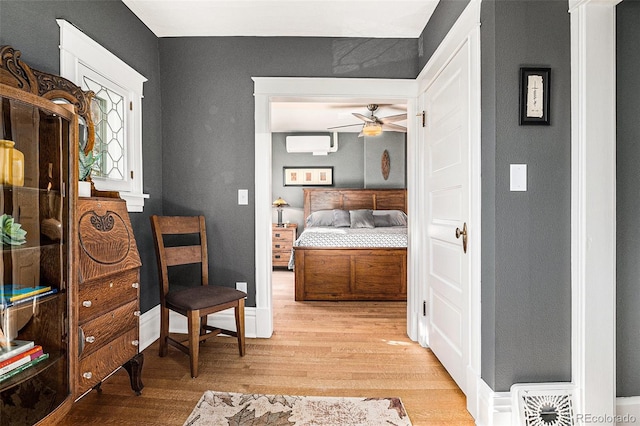 1419 N Adams St, Denver, CO 80206 - bedroom with a wall mounted air conditioner and wood finished floors