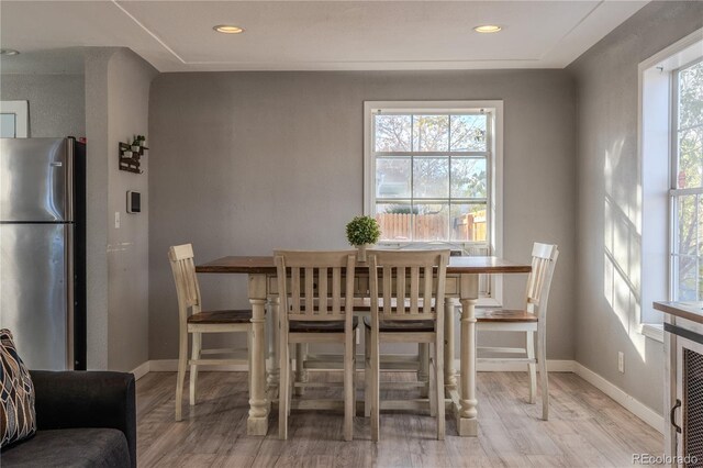 dining space featuring light hardwood / wood-style flooring