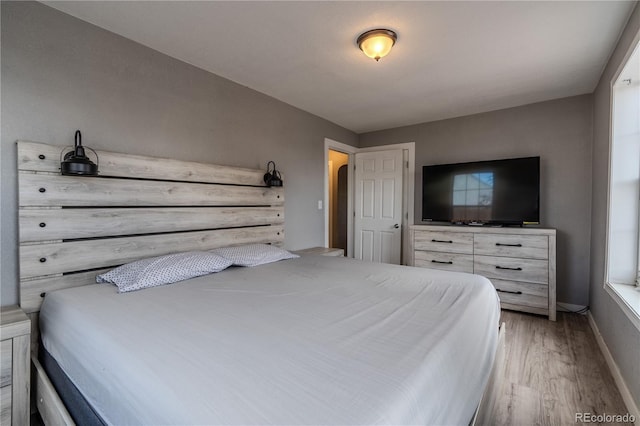 bedroom featuring light hardwood / wood-style floors