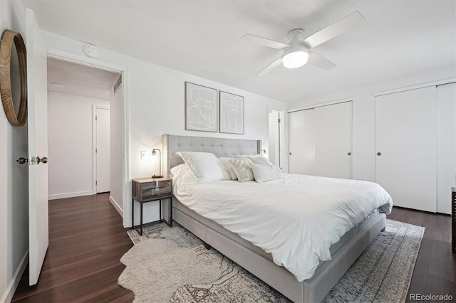 8981 E Amherst Dr Unit E, Denver, CO 80231 - bedroom with wood finished floors, multiple closets, baseboards, and ceiling fan