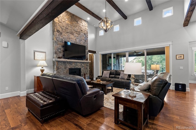 8326 Raphael Ln, Littleton, CO 80125 - living area with beamed ceiling, a fireplace, a high ceiling, and dark wood finished floors