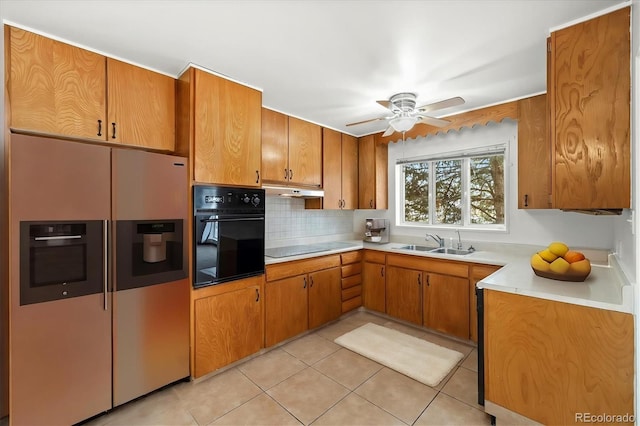 kitchen with sink, ceiling fan, tasteful backsplash, black appliances, and light tile patterned flooring