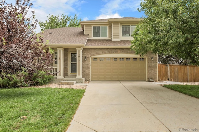 4912 S Fultondale Way, Aurora, CO 80016 - view of front facade featuring brick siding, concrete driveway, a shingled roof, and an attached garage