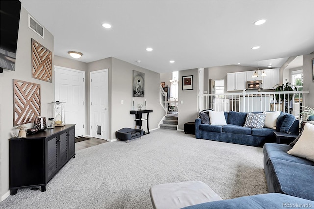 4912 S Fultondale Way, Aurora, CO 80016 - living room featuring carpet floors, stairway, and recessed lighting