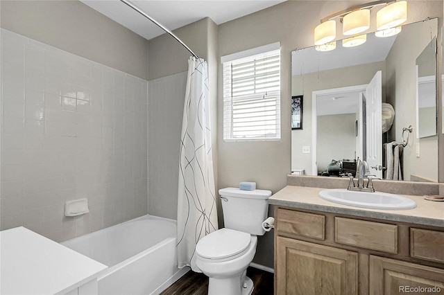 4912 S Fultondale Way, Aurora, CO 80016 - bathroom featuring vanity, shower / bath combination with curtain, and wood finished floors
