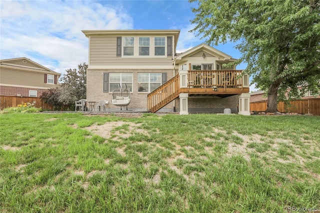 4912 S Fultondale Way, Aurora, CO 80016 - rear view of property with a wooden deck, stairway, a fenced backyard, brick siding, and a patio area
