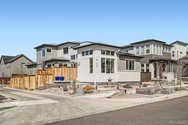 prairie-style house with fence