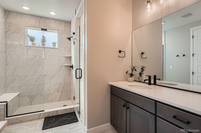 bathroom featuring visible vents, baseboards, a stall shower, marble finish floor, and vanity