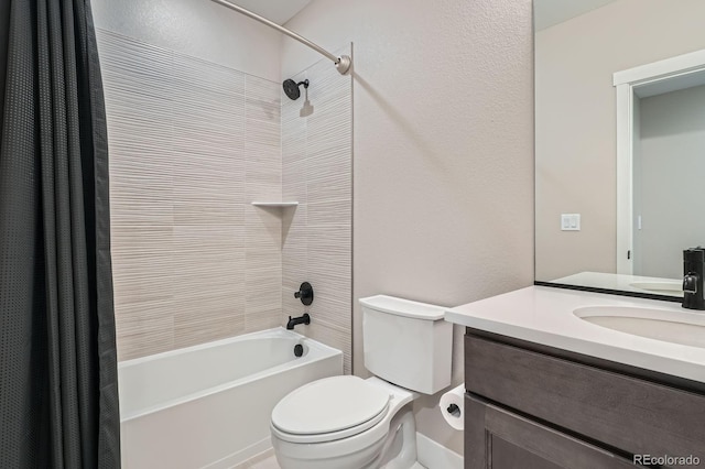 full bath with a textured wall, shower / tub combo with curtain, vanity, and toilet