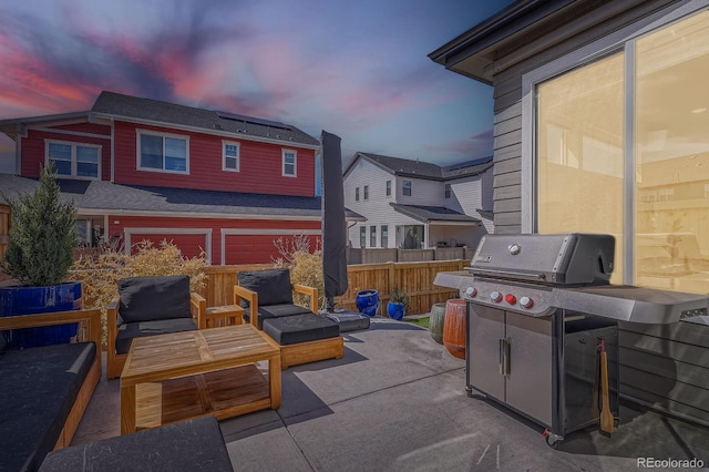 view of patio with grilling area, fence, and an outdoor hangout area