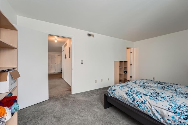 bedroom featuring dark carpet