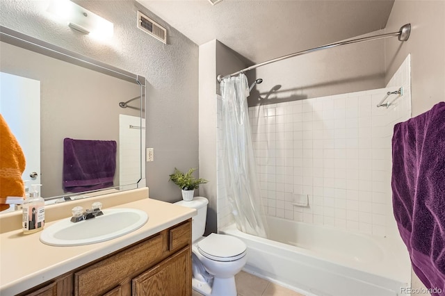 full bathroom featuring tile patterned floors, toilet, a textured ceiling, vanity, and shower / bath combination with curtain