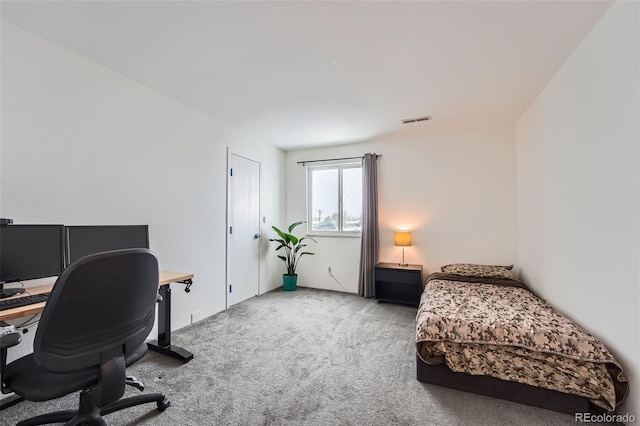 bedroom featuring light colored carpet