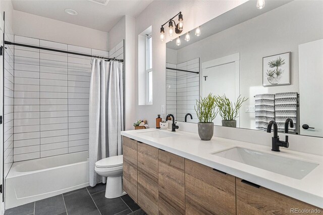 bathroom featuring toilet, tile patterned flooring, a sink, and shower / bathtub combination with curtain