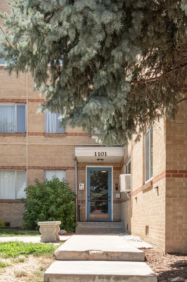 doorway to property with cooling unit