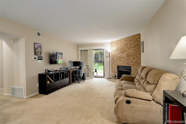 3518 S Depew St Unit 102, Lakewood, CO 80235 - living area featuring carpet floors, a fireplace, and baseboards