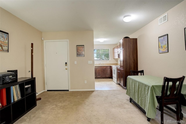 3518 S Depew St Unit 102, Lakewood, CO 80235 - dining space with light colored carpet and baseboards