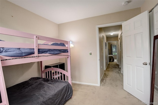 3518 S Depew St Unit 102, Lakewood, CO 80235 - bedroom featuring light colored carpet and baseboards