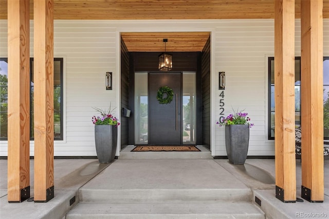 4520 W Moncrieff Pl, Denver, CO 80212 - doorway to property with a porch