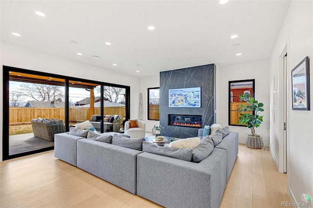 4520 W Moncrieff Pl, Denver, CO 80212 - living room with light wood-style flooring, recessed lighting, and a high end fireplace