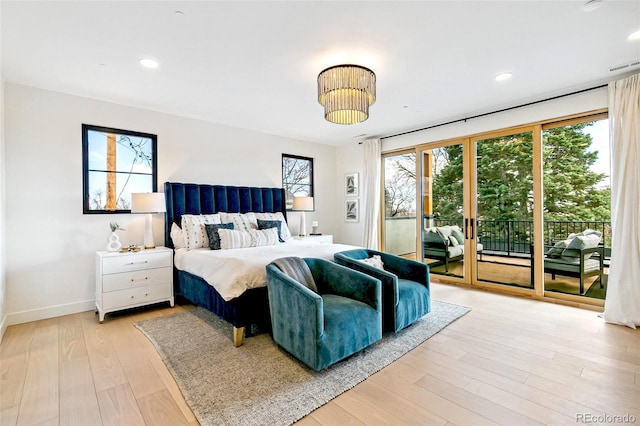4520 W Moncrieff Pl, Denver, CO 80212 - bedroom featuring access to exterior, light wood-style flooring, french doors, and recessed lighting
