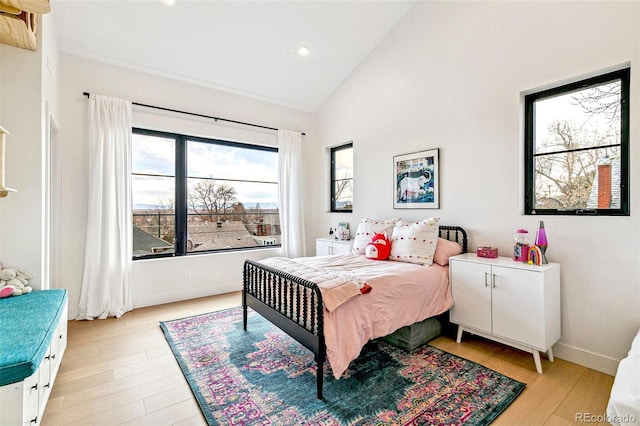 4520 W Moncrieff Pl, Denver, CO 80212 - bedroom with recessed lighting, light wood-type flooring, and high vaulted ceiling
