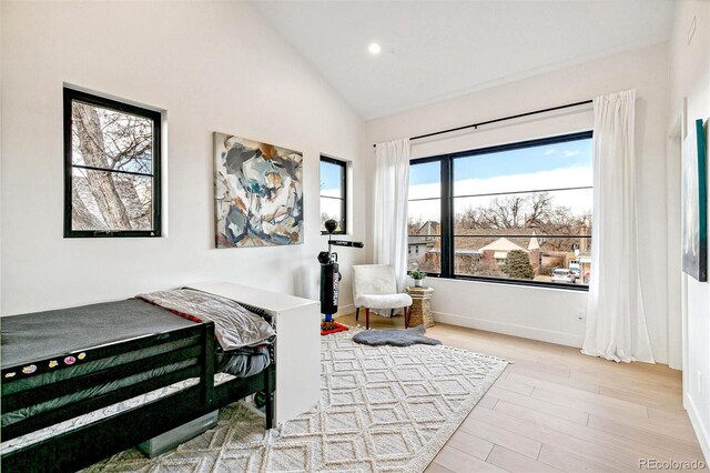 4520 W Moncrieff Pl, Denver, CO 80212 - bedroom featuring wood finished floors, recessed lighting, and high vaulted ceiling